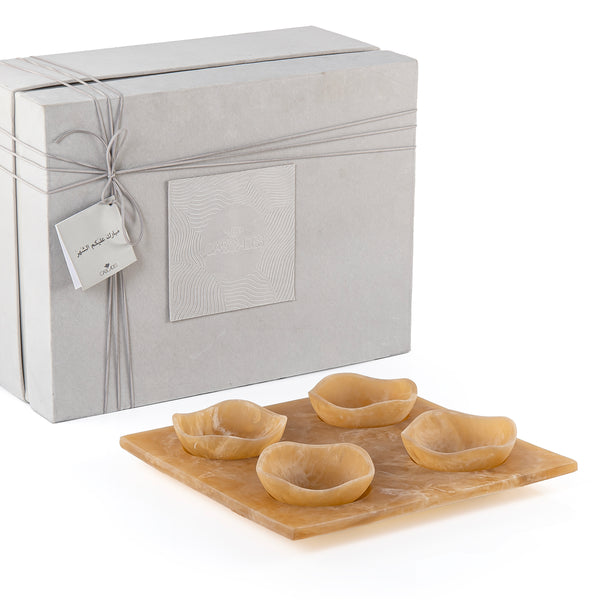 Set of 4 yellow serving bowls set on tray with gift box