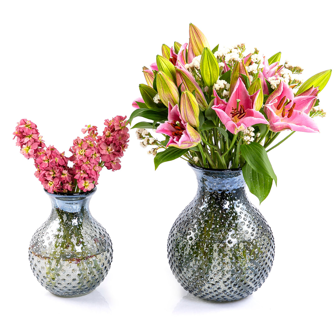 Set of colorful lilies and blossom glass vase