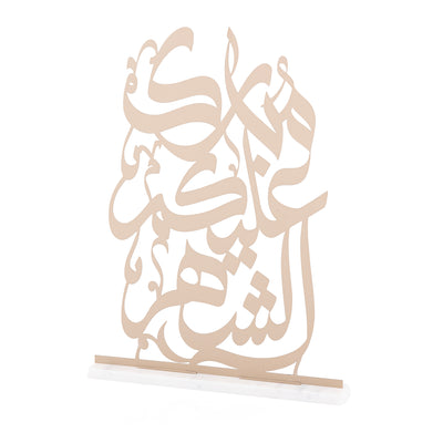 Dusty color text written on steel "congratulations for this month" with white color marble base.